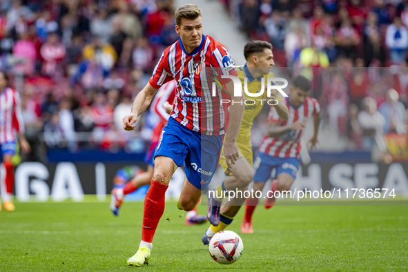 Alexander Sorloth of Atletico de Madrid is in action with the ball during the La Liga EA Sports 2024/25 football match between Atletico de M...