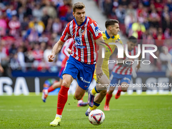 Alexander Sorloth of Atletico de Madrid is in action with the ball during the La Liga EA Sports 2024/25 football match between Atletico de M...