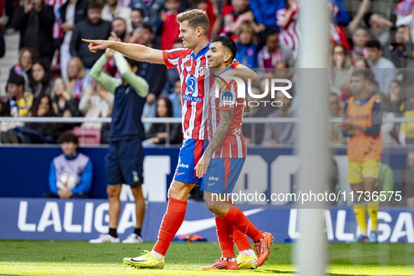 Alexander Sorloth of Atletico de Madrid (L) celebrates his goal with Angel Correa of Atletico de Madrid (R) during the La Liga EA Sports 202...