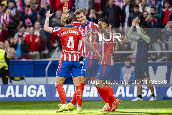 Alexander Sorloth of Atletico de Madrid celebrates his goal with Angel Correa and Conor Gallagher of Atletico de Madrid during the La Liga E...