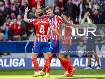 Alexander Sorloth of Atletico de Madrid celebrates his goal with Angel Correa and Conor Gallagher of Atletico de Madrid during the La Liga E...