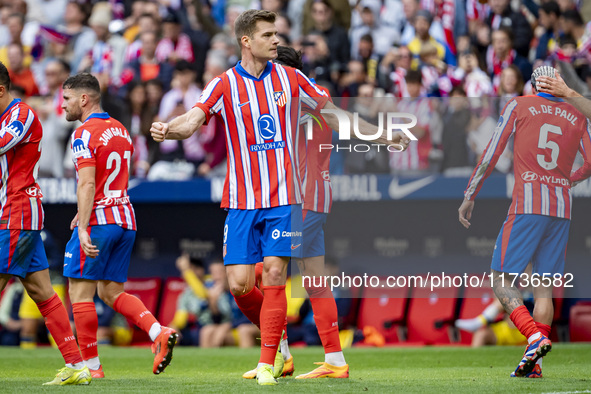 Alexander Sorloth of Atletico de Madrid (C) celebrates his goal during the La Liga EA Sports 2024/25 football match between Atletico de Madr...