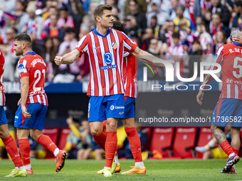 Alexander Sorloth of Atletico de Madrid (C) celebrates his goal during the La Liga EA Sports 2024/25 football match between Atletico de Madr...