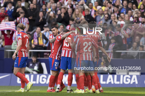 In Madrid, Spain, on November 3, several players of Atletico de Madrid celebrate a goal during the La Liga 2024/25 match between Atletico de...