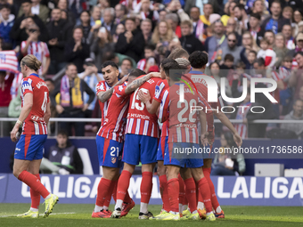 In Madrid, Spain, on November 3, several players of Atletico de Madrid celebrate a goal during the La Liga 2024/25 match between Atletico de...