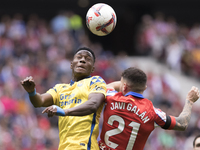 Javi Galan of Atletico de Madrid and Dario Essugo of Las Palmas fight for the ball during the La Liga 2024/25 match between Atletico de Madr...