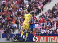 In Madrid, Spain, on November 3, Lenglet of Atletico de Madrid and Fabio Silva of Las Palmas fight for the ball during the La Liga 2024/25 m...