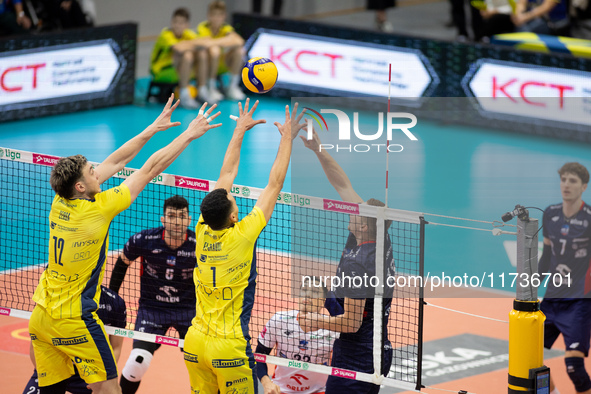 Nicolas Zerba, Zouheir El Graoui, and Rafal Szymura participate in a PLUS Liga match between Stal Nysa and ZAKSA Kedzierzyn Kozle in Nysa, P...