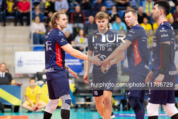 Mateusz Recko, Mateusz Poreba, and Rafal Szymura participate in a match of the PLUS Liga between Stal Nysa and ZAKSA Kedzierzyn Kozle in Nys...