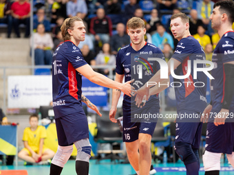 Mateusz Recko, Mateusz Poreba, and Rafal Szymura participate in a match of the PLUS Liga between Stal Nysa and ZAKSA Kedzierzyn Kozle in Nys...