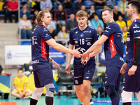 Mateusz Recko, Mateusz Poreba, and Rafal Szymura participate in a match of the PLUS Liga between Stal Nysa and ZAKSA Kedzierzyn Kozle in Nys...