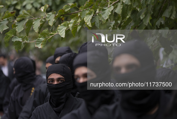 Iranian Ninja men participate in an anti-U.S. and anti-Israel rally marking the anniversary of the U.S. embassy occupation at the former U.S...