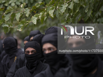 Iranian Ninja men participate in an anti-U.S. and anti-Israel rally marking the anniversary of the U.S. embassy occupation at the former U.S...