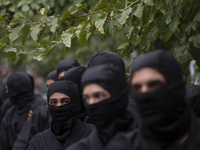 Iranian Ninja men participate in an anti-U.S. and anti-Israel rally marking the anniversary of the U.S. embassy occupation at the former U.S...