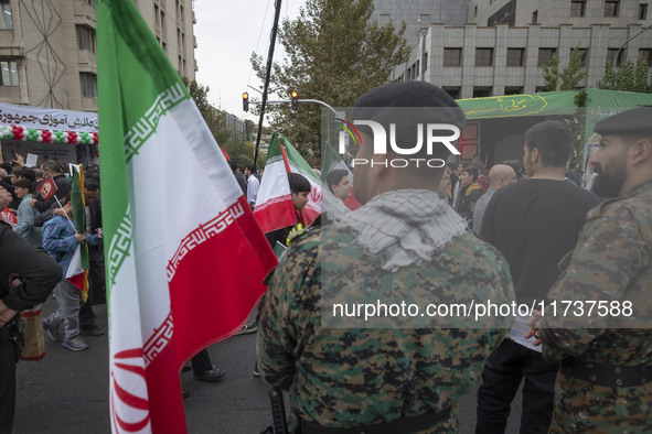 Two military personnel of the Iranian police special forces monitor an area during an anti-U.S. and anti-Israel rally marking the anniversar...