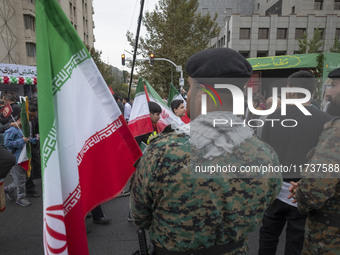 Two military personnel of the Iranian police special forces monitor an area during an anti-U.S. and anti-Israel rally marking the anniversar...