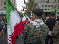 Two military personnel of the Iranian police special forces monitor an area during an anti-U.S. and anti-Israel rally marking the anniversar...