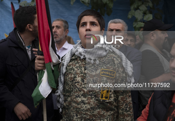 A young military personnel of the Islamic Revolutionary Guard Corps participates in an anti-U.S. and anti-Israel rally marking the anniversa...