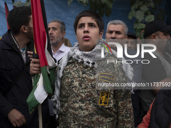 A young military personnel of the Islamic Revolutionary Guard Corps participates in an anti-U.S. and anti-Israel rally marking the anniversa...