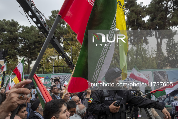 A military personnel of the Islamic Revolutionary Guard Corps (IRGC) Special Force monitors an area during an anti-U.S. and anti-Israel rall...