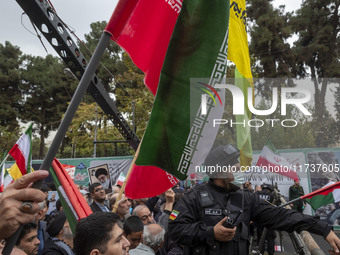 A military personnel of the Islamic Revolutionary Guard Corps (IRGC) Special Force monitors an area during an anti-U.S. and anti-Israel rall...