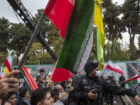 A military personnel of the Islamic Revolutionary Guard Corps (IRGC) Special Force monitors an area during an anti-U.S. and anti-Israel rall...