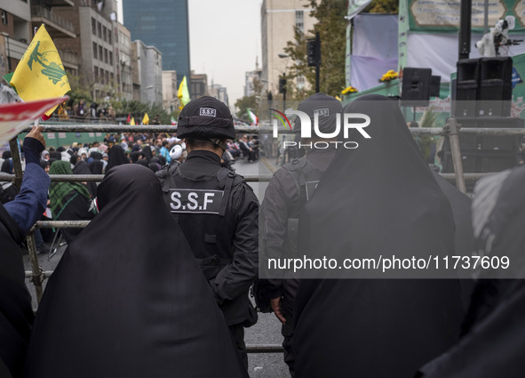 Two military personnel of the Islamic Revolutionary Guard Corps (IRGC) Special Force monitor an area during an anti-U.S. and anti-Israel ral...