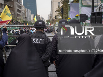 Two military personnel of the Islamic Revolutionary Guard Corps (IRGC) Special Force monitor an area during an anti-U.S. and anti-Israel ral...