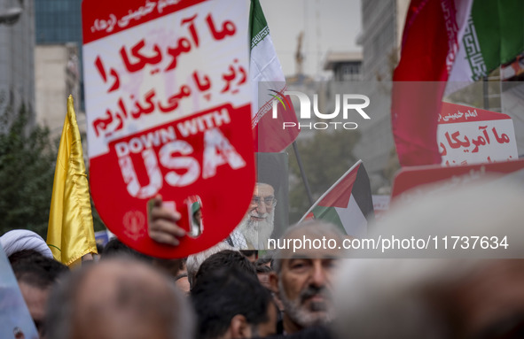 An Iranian demonstrator (not pictured) holds a portrait of Iran's Supreme Leader, Ayatollah Ali Khamenei, during an anti-U.S. and anti-Israe...