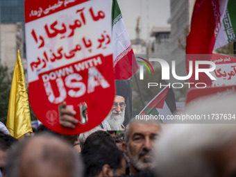 An Iranian demonstrator (not pictured) holds a portrait of Iran's Supreme Leader, Ayatollah Ali Khamenei, during an anti-U.S. and anti-Israe...