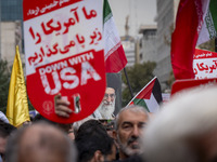 An Iranian demonstrator (not pictured) holds a portrait of Iran's Supreme Leader, Ayatollah Ali Khamenei, during an anti-U.S. and anti-Israe...