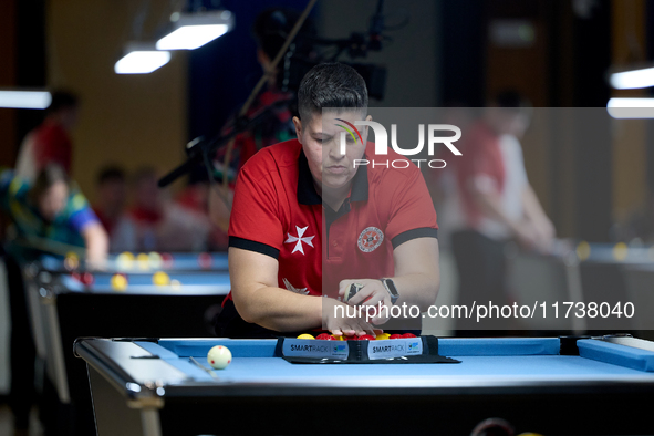 Lorna Micallef from the Malta Blackball ladies national team prepares the rack of balls before one of the events at the inaugural IBF World...