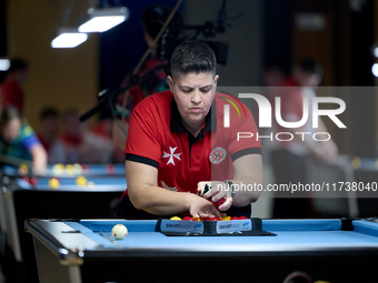 Lorna Micallef from the Malta Blackball ladies national team prepares the rack of balls before one of the events at the inaugural IBF World...