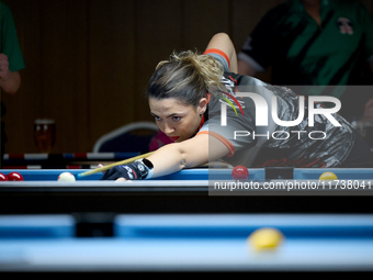 Jennifer Rumbado from the Gibraltar Pool Association ladies national team performs during one of the events at the inaugural IBF World Black...