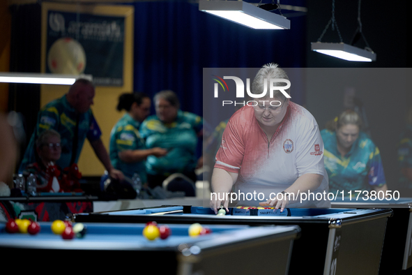 Lorna Micallef from the English Blackball Pool Federation ladies national team prepares the rack of balls before one of the events at the in...