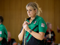 A blackball player from the Northern Ireland Pool Association ladies national team participates in one of the events at the inaugural IBF Wo...