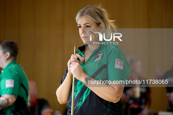 A blackball player from the Northern Ireland Pool Association ladies national team participates in one of the events at the inaugural IBF Wo...