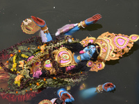 An idol of the Hindu goddess Kali floats after being immersed in a pond in Kolkata, India, on November 3, 2024. (