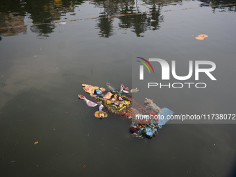 An idol of the Hindu goddess Kali floats after being immersed in a pond in Kolkata, India, on November 3, 2024. (