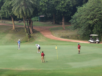 People play golf inside a golf course in Kolkata, India, on November 3, 2024. (