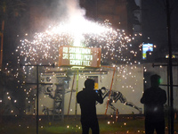 People enjoy a fireworks show in Kolkata, India, on November 3, 2024. (