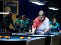 A female blackball player from the English Blackball Pool Federation ladies national team prepares the rack of balls before one of the event...