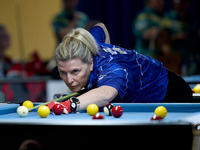 A participant from the Scotland Eightball Pool Federation ladies team performs during one of the events from the inaugural IBF World Blackba...