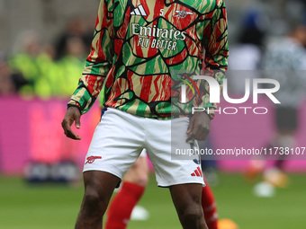 Thomas Partey of Arsenal warms up during the Premier League match between Newcastle United and Arsenal at St. James's Park in Newcastle, Uni...