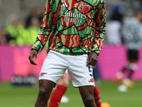 Thomas Partey of Arsenal warms up during the Premier League match between Newcastle United and Arsenal at St. James's Park in Newcastle, Uni...