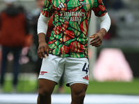 Arsenal's Myles Lewis-Skelly warms up during the Premier League match between Newcastle United and Arsenal at St. James's Park in Newcastle,...