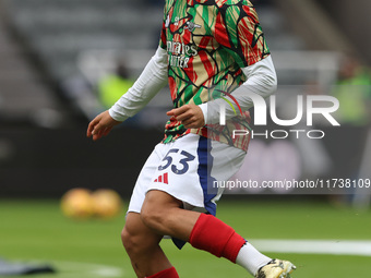 Ethan Nwaneri warms up during the Premier League match between Newcastle United and Arsenal at St. James's Park in Newcastle, United Kingdom...