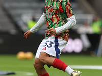 Ethan Nwaneri warms up during the Premier League match between Newcastle United and Arsenal at St. James's Park in Newcastle, United Kingdom...