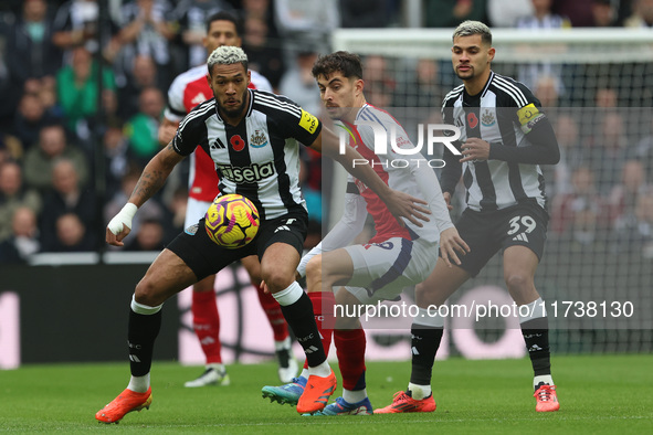 Newcastle United's Joelinton is in action with Arsenal's Kai Havertz during the Premier League match between Newcastle United and Arsenal at...