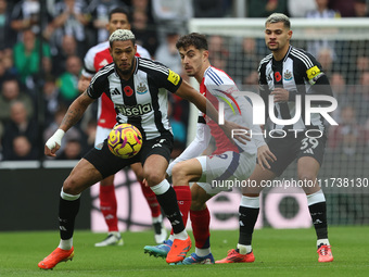 Newcastle United's Joelinton is in action with Arsenal's Kai Havertz during the Premier League match between Newcastle United and Arsenal at...